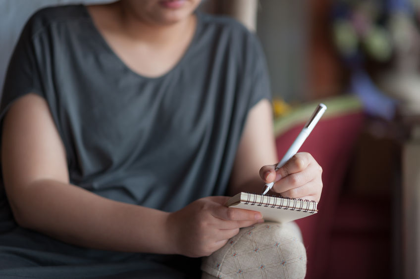 Left-handed Woman Writing