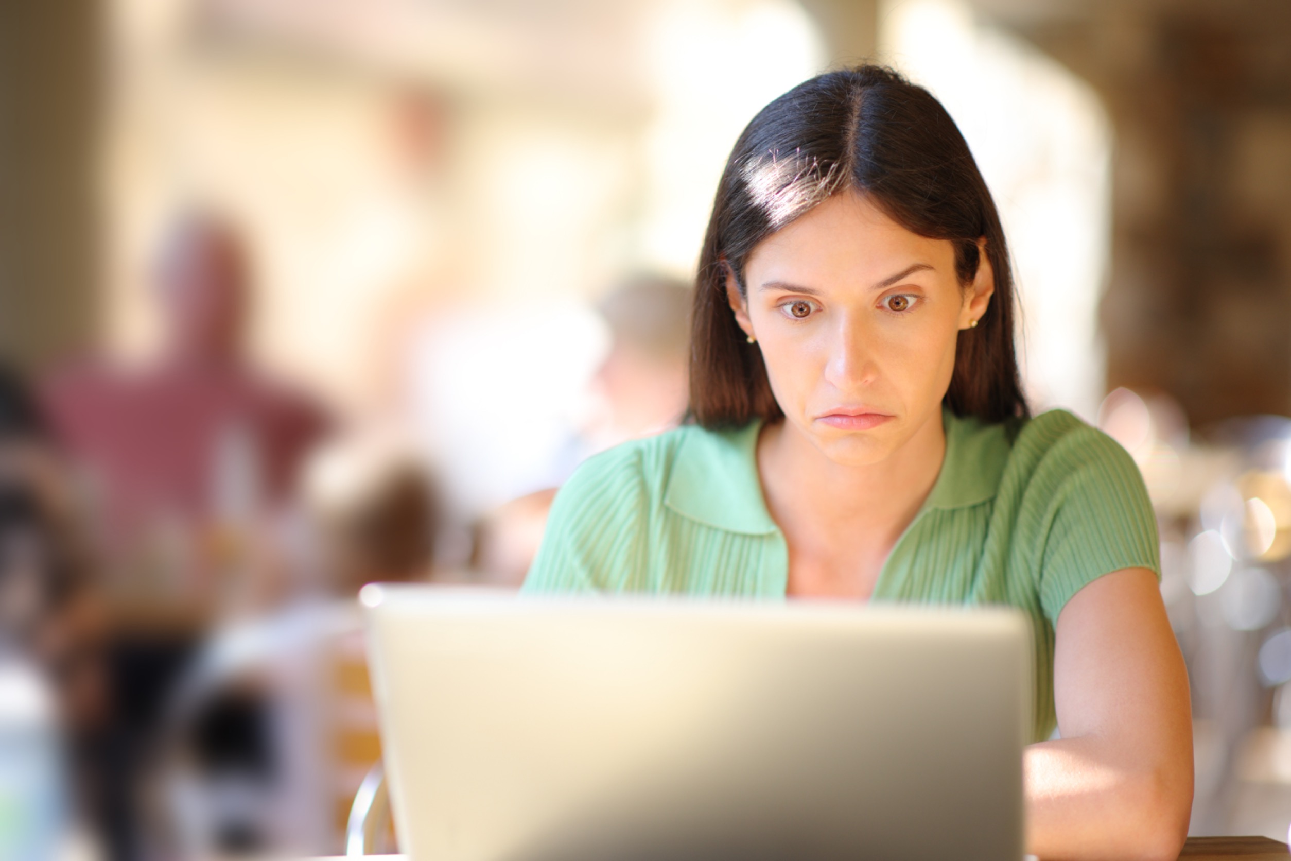 Perplexed Woman Checking Laptop