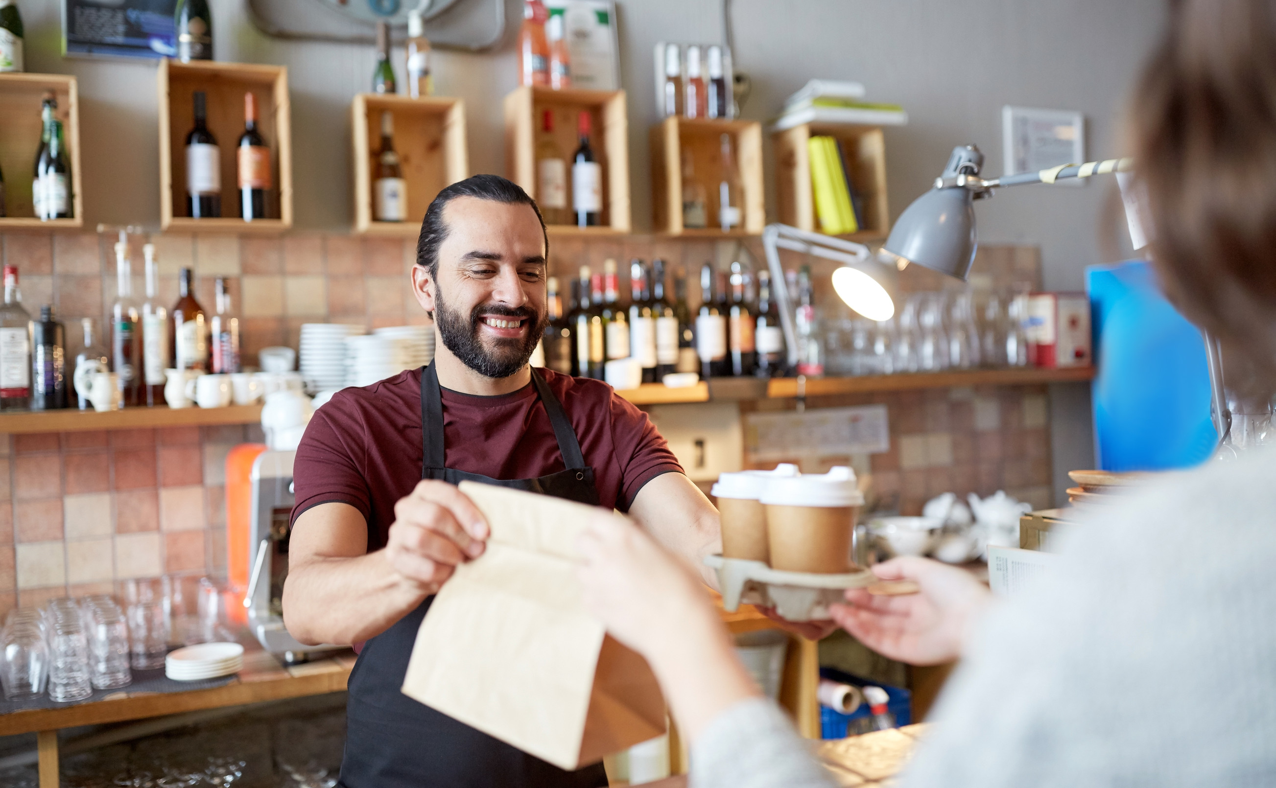 Serving Customer at Coffee Shop